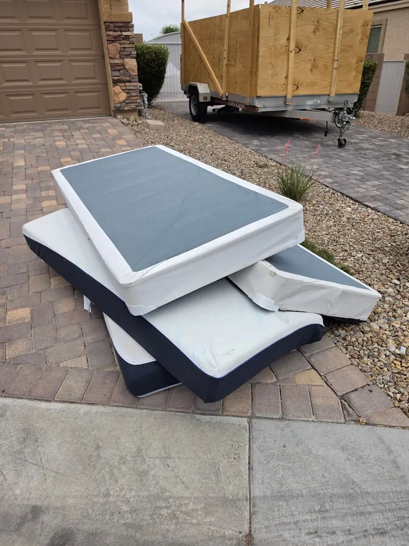 Box springs set out on pavers for pickup in a Las Vegas valley driveway