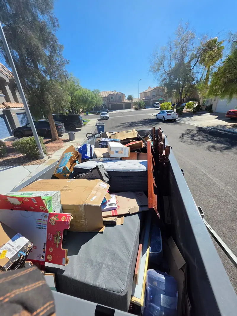 Trailer packed with boxes, a sectional and household items on a Las Vegas valley street