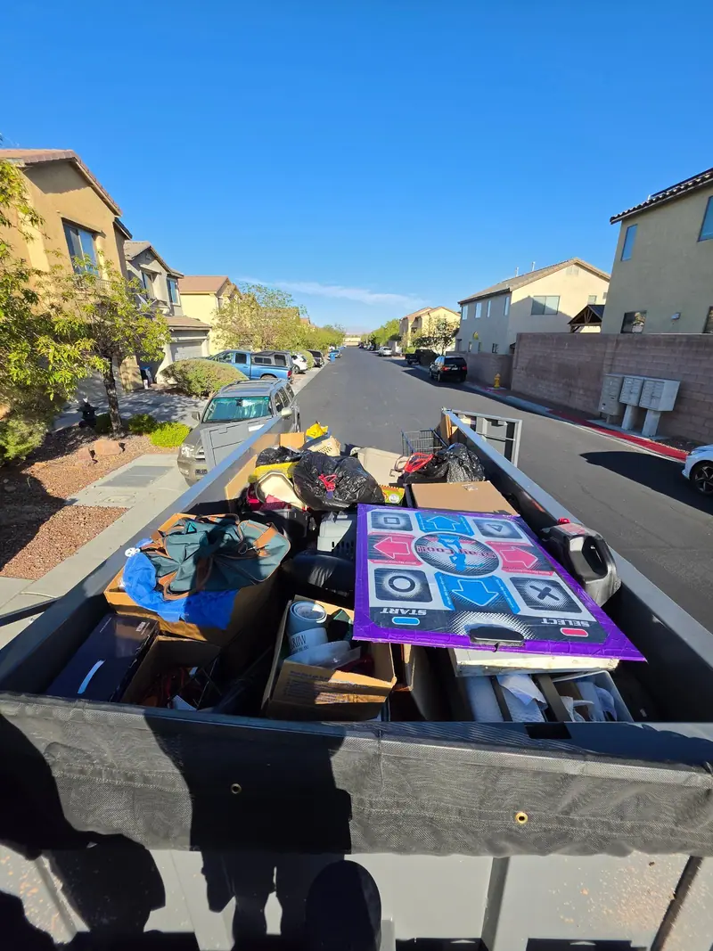 Trailer loaded with household junk, view down a Las Vegas valley street