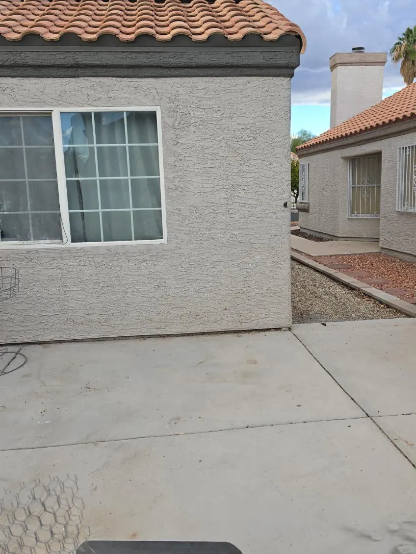 The same back patio empty after the sectional was hauled away