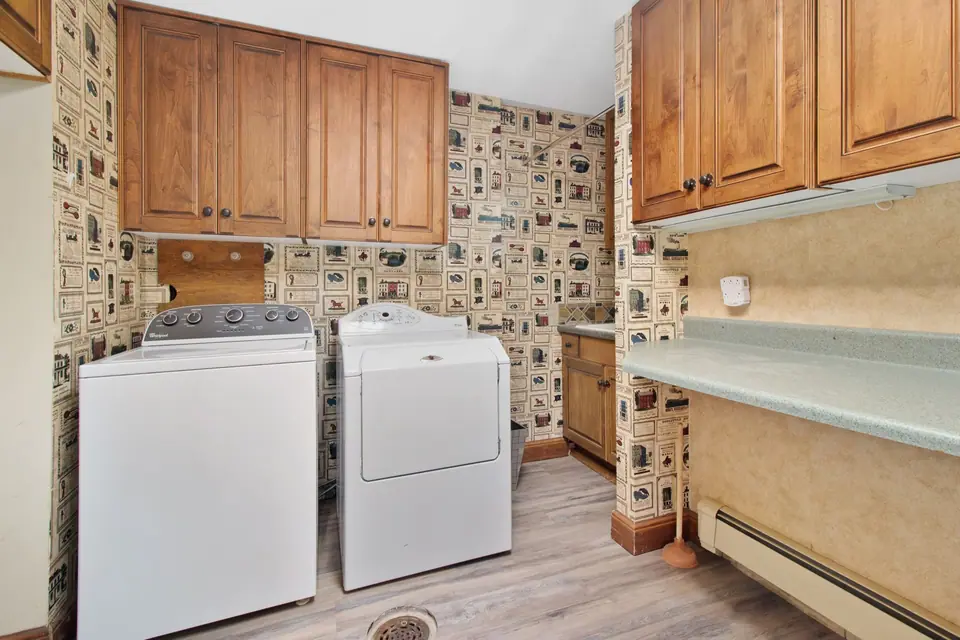 Older washer and dryer in a laundry room (representative photo)